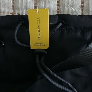 Beyond Yoga Black Drawstring Bag with Yellow Tag
